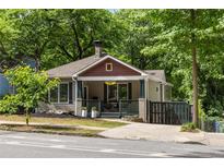 Charming craftsman-style home with a cozy front porch and a manicured lawn at 770 Ormewood Se Ave, Atlanta, GA 30312
