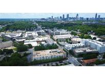Fantastic aerial view of the property, showing the Atlanta skyline and lush, green surroundings at 881 Memorial Se Dr # 307, Atlanta, GA 30316