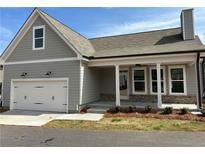 Charming single-Gathering home featuring an attached garage and covered porch at 241 Saratoga Dr, Acworth, GA 30102