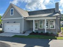 Charming single-Gathering home with a two-car garage, lovely landscaping, and inviting curb appeal at 241 Saratoga Dr, Acworth, GA 30102