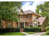 Charming brick two-story home with a landscaped front yard and inviting entrance at 320 Kirk Rd, Decatur, GA 30030