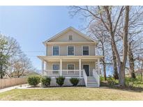 Charming two-story home with a welcoming front porch and well-maintained lawn at 1303 Hill Se St, Atlanta, GA 30315