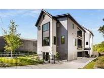 Stunning modern two-story home with black trim and a well-manicured lawn and dark gray exterior at 219 Howell Se Dr # A, Atlanta, GA 30316