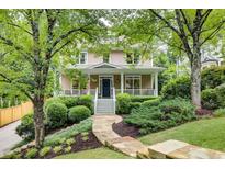 Charming two-story home with a landscaped front yard and inviting front porch at 1043 Elizabeth Ne Ct, Atlanta, GA 30306