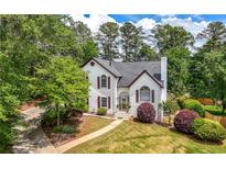 Charming two-story home with landscaped front yard and inviting walkway at 9206 Denmeade Trce, Douglasville, GA 30135