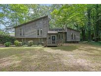 Charming home with unique architectural details surrounded by lush, mature trees at 361 Gordon Valley Sw Ln, Mableton, GA 30126