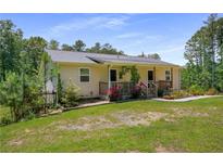Charming single-story home with a wooden porch and well-maintained landscaping at 212 Postell Rd, Dallas, GA 30157
