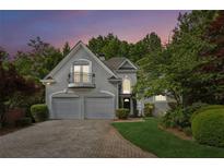 Charming two-story home with a balcony, two-car garage, and landscaped front yard at 4217 Wieuca Overlook Ne, Atlanta, GA 30342