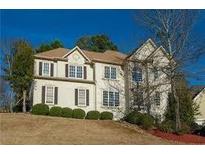 Beautiful two-story home featuring a well-maintained lawn, attractive landscaping, and classic architectural details at 600 Oakmont Hl, Duluth, GA 30097
