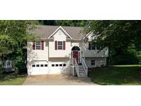 Charming two-story home with a well-maintained front yard and a two-car garage at 279 Fairview Dr, Dallas, GA 30157