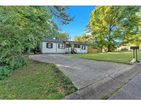 Charming single-story home with a well-manicured lawn and inviting curb appeal at 54 Mildred Ct, Dallas, GA 30157