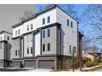 Contemporary townhome showcasing a modern design with a private garage in a desirable community at 1836 Memorial Dr # 303, Atlanta, GA 30317
