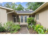 Inviting front entrance with double doors and lush landscaping at 4040 Summit Dr, Marietta, GA 30068