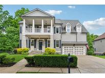 Charming two-story home with a landscaped yard and a welcoming front porch at 4815 Westgate Drive, Cumming, GA 30040