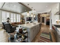 Bright, open-concept kitchen features a large island and stainless steel appliances at 58 Canton St # 410, Alpharetta, GA 30009