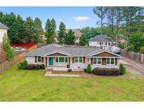 Charming, renovated ranch with a well-manicured lawn, brick exterior, and a new roof at 2221 Shallowford Rd, Marietta, GA 30066