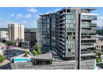 Stunning high-rise featuring modern architecture, balconies, city views, and a rooftop pool at 3107 Peachtree Ne Rd # 1005, Atlanta, GA 30305