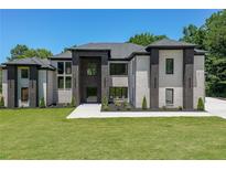 Striking new two-story home boasting a black and white brick facade and manicured lawn at 972 Auburn Rd, Dacula, GA 30019