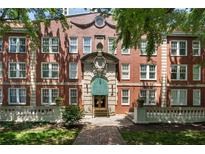 Beautiful brick apartment building with meticulously maintained landscaping and a stately entrance at 2840 Peachtree Nw Rd # 307, Atlanta, GA 30305