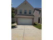 Two-story home featuring a two-car garage and driveway at 6474 Grey Fox Way, Riverdale, GA 30296