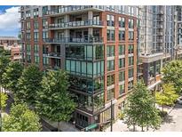 Modern condo building featuring a Starbucks on ground floor and private balconies at 867 Peachtree Ne St # 202, Atlanta, GA 30308