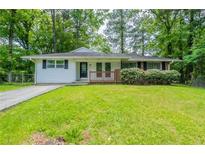 Charming one-story home featuring a well-maintained lawn and inviting curb appeal at 2499 Shiloh Dr, Decatur, GA 30034