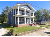 Charming two-story home with a covered porch and balcony offering beautiful views at 117 Joseph E Lowery Nw Blvd, Atlanta, GA 30314