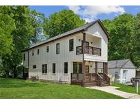 Beautiful two-story home featuring board and batten siding, a covered front porch, and a second-story balcony at 515 Cohen St, Atlanta, GA 30310