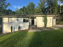 Charming single-story home with a well-maintained lawn and inviting front entrance at 2636 Flagstone Se Dr, Atlanta, GA 30316