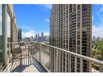 City views from this unit's private balcony with seating and glass railing at 361 17Th Nw St # 2607, Atlanta, GA 30363