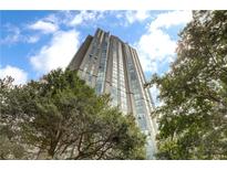 Modern high-rise exterior with ample windows and bright blue sky views at 2870 Pharr Court South Nw # 2404, Atlanta, GA 30305