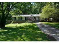 Charming one-story home with a well-manicured lawn and a cozy front porch at 377 Black Oak Ct, Lawrenceville, GA 30046
