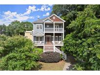 Charming two-story home with double porches, lush landscaping, and inviting curb appeal at 1797 Olive Se St, Atlanta, GA 30315