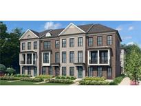 Charming brick townhome with a small porch and well-maintained landscaping at 205 Midnight Oak Run # 5, Alpharetta, GA 30009