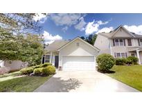 Charming single-Gathering home features a two-car garage and well-maintained landscaping at 3827 Shenfield Dr, Union City, GA 30291