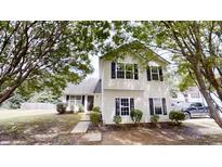 Charming two-story home with black shutters and mature trees shading the landscaped front yard at 4162 Ward Lake Trl, Ellenwood, GA 30294