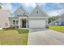 Charming two-story home with a well-manicured lawn, a two-car garage and inviting curb appeal at 107 Cedar Brook Dr, Canton, GA 30115