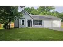 Charming single-story home with a well-manicured lawn and attached garage, perfect for suburban living at 4052 Keheley Glen Ne Dr, Marietta, GA 30066