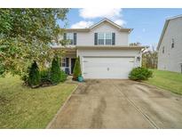 Charming two-story home with a well-manicured lawn and a two-car garage at 3530 Ridge Hill Pkwy, Douglasville, GA 30135