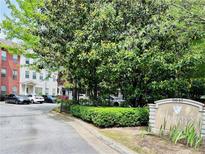 View of the Brighton Court community entrance and surrounding landscaping at 5641 Roswell Rd # 111, Sandy Springs, GA 30342