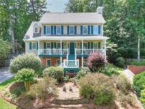 Charming two-story home with a welcoming front porch and beautiful landscaping at 1935 Shrader Ct, Lawrenceville, GA 30044