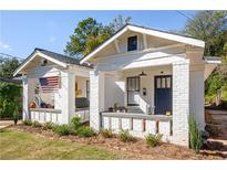 Charming bungalow duplex with inviting front porches and American flag at 23 Clifton Se St, Atlanta, GA 30317