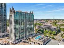 High-rise building with a pool on the roof, offering urban living with skyline views at 361 17Th Nw St # 1603, Atlanta, GA 30363