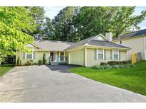 Charming single-story home with a well-manicured lawn and inviting curb appeal at 2107 Sandtree Sw Ct, Atlanta, GA 30331