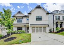 Beautiful two-story home with a two-car garage, manicured lawn, and lovely curb appeal at 1620 Branthaven Ln, Auburn, GA 30011