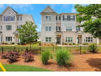 Charming townhome showcasing craftsman-style architecture, professional landscaping, and a welcoming front entrance at 1768 Evenstad Way, Smyrna, GA 30080