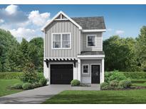 Charming two-story home with a modern gray exterior, a black garage door, and a well-maintained lawn at 27 Benscot Dr, Austell, GA 30106