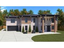 Striking two-story home showcases brick accents, contemporary design, and a spacious driveway at 1349 Oak Road, Lilburn, GA 30047