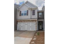 Charming two-story home featuring a two-car garage and stone accents at 961 Pierce Ivy Ct, Lawrenceville, GA 30043