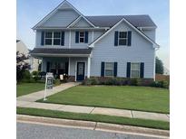 Charming two-story home featuring a well-manicured lawn and inviting front porch at 258 Creek View Ln, Acworth, GA 30102